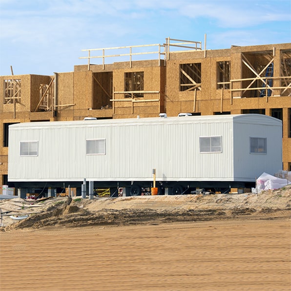 we offer delivery and setup of construction trailers at the construction site